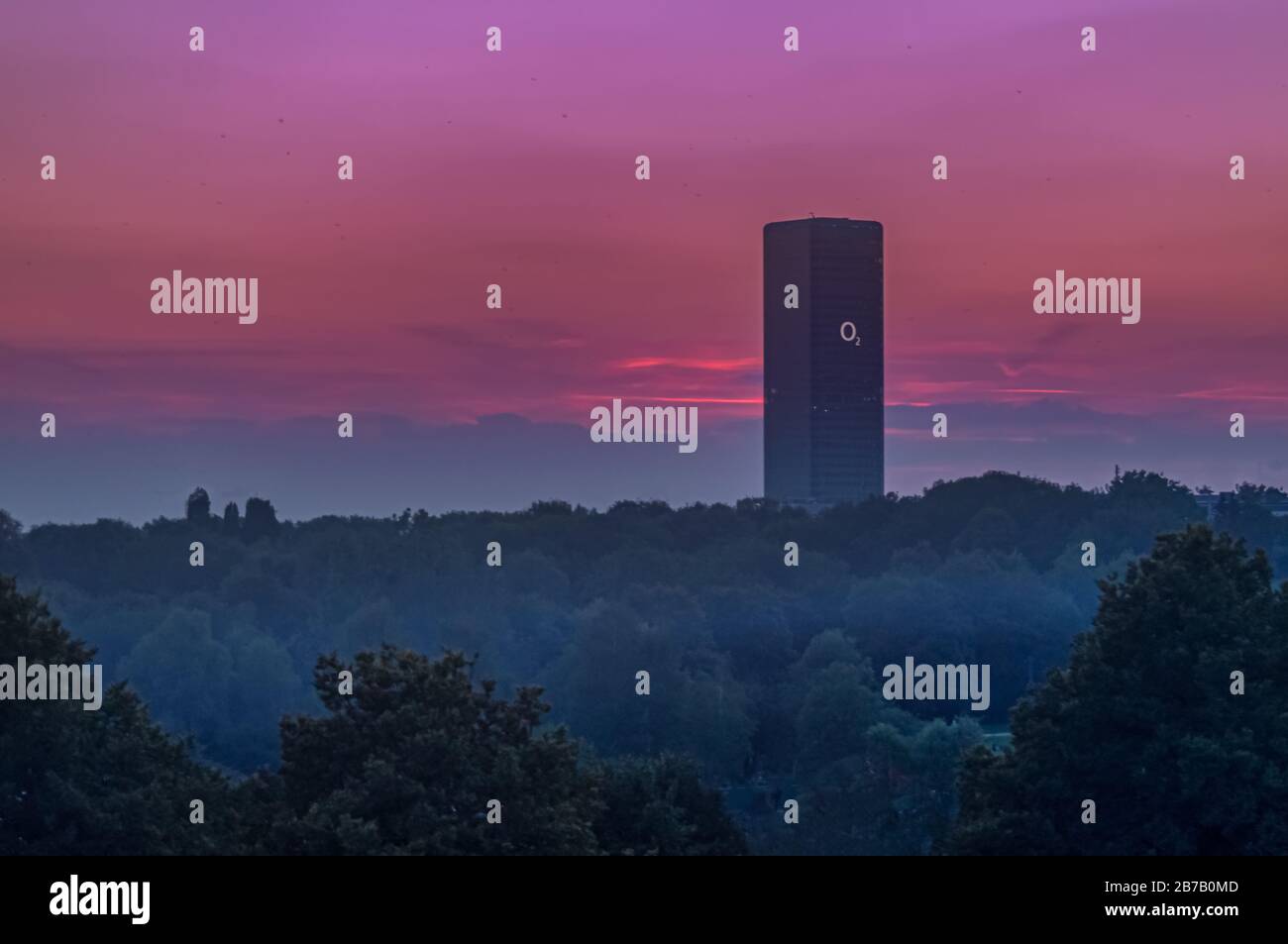 The O2 Tower of Munich at a beautiful violett sunset. Stock Photo