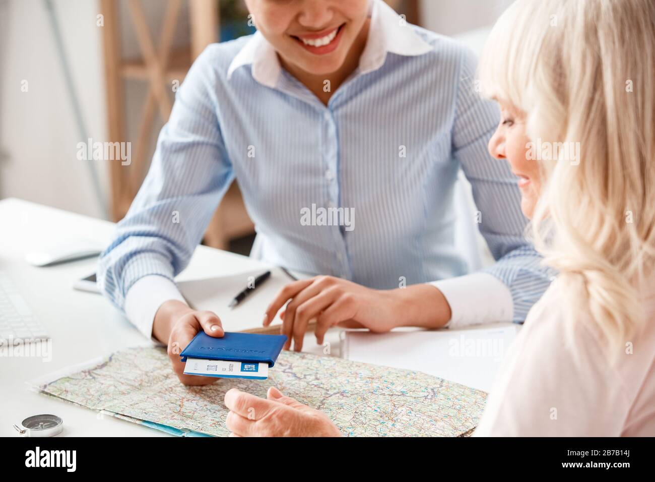 Mature woman passport map hi-res stock photography and images - Alamy
