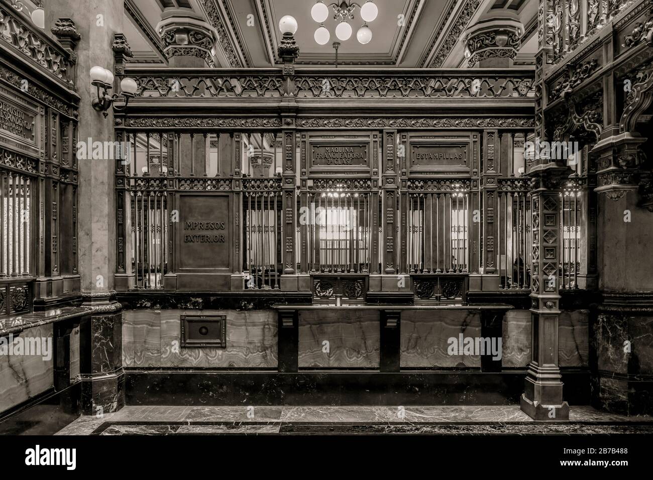 Mexico City main post office was built in 1907 and is comprised of many architectural styles including extensive use of ornate polished brass. Stock Photo