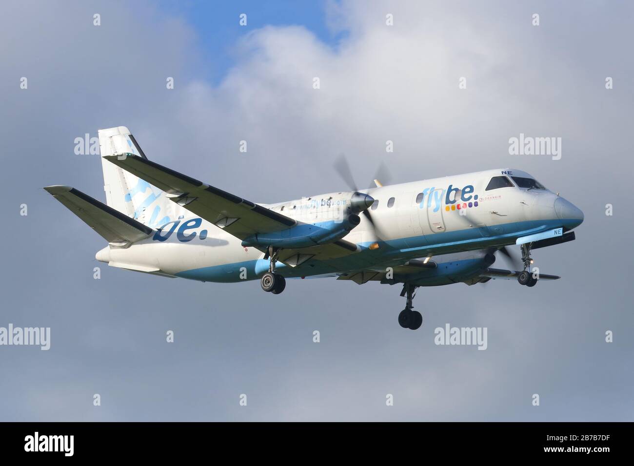 A Flybe aircraft making a landing at Leeds Bradford International Airport Stock Photo
