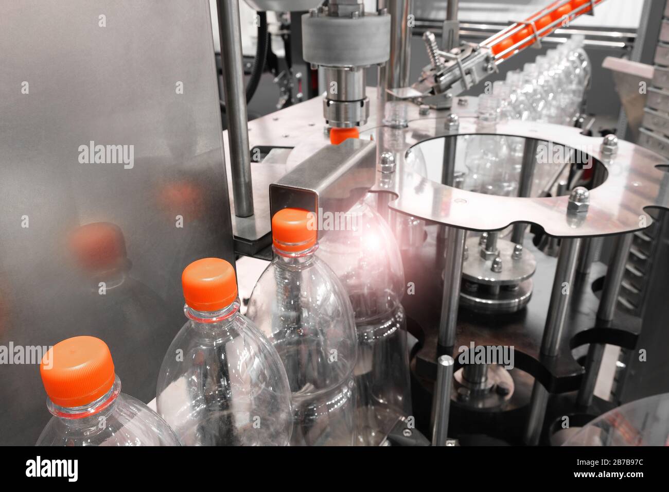 Bottle. Industrial production of plastic pet bottles. Factory line for