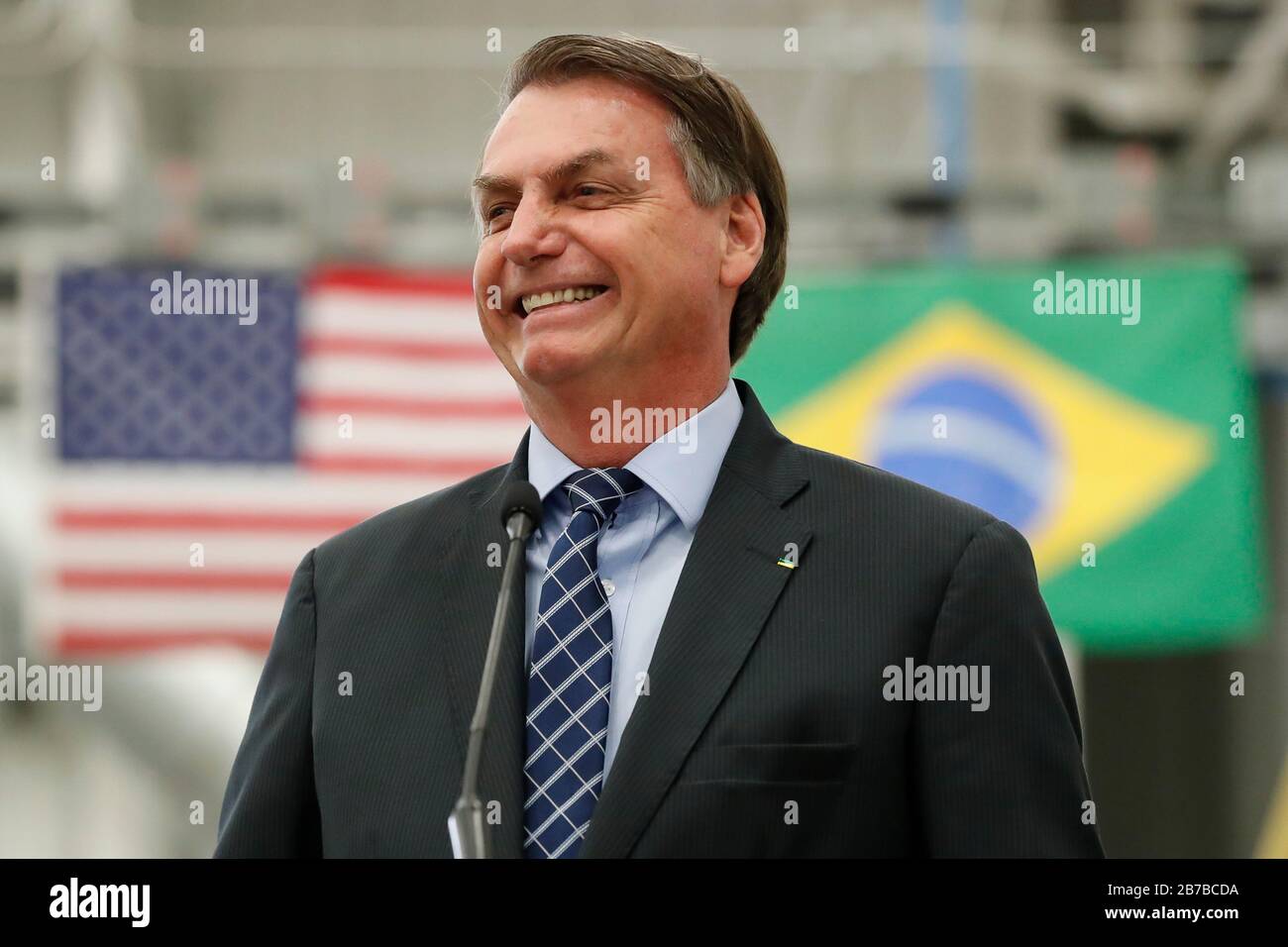 Brazilian President Jair Bolsonaro speaks during a visit to an assembly plant of the  Brazilian plane maker Embraer  March 10, 2020 in Jacksonville, Florida. The factory makes the Embraer EMB 314 Super Tucano turboprop light attack aircraft in a partnership with Sierra Nevada Corporation. Stock Photo