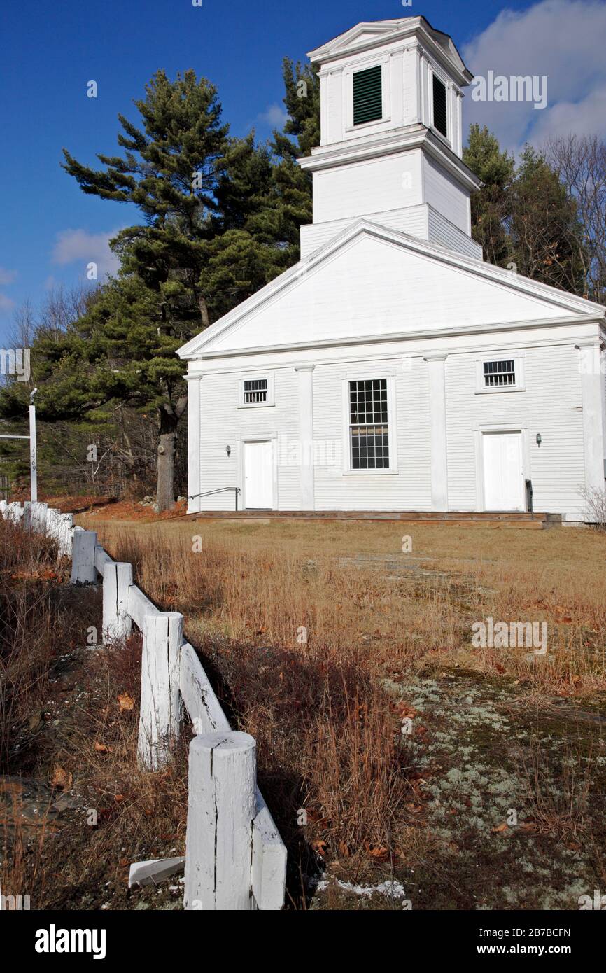 First Baptist Church of Gilmanton in Gilmanton, New Hampshire during the autumn months. Built in 1842, this Greek revival church is also known as the Stock Photo