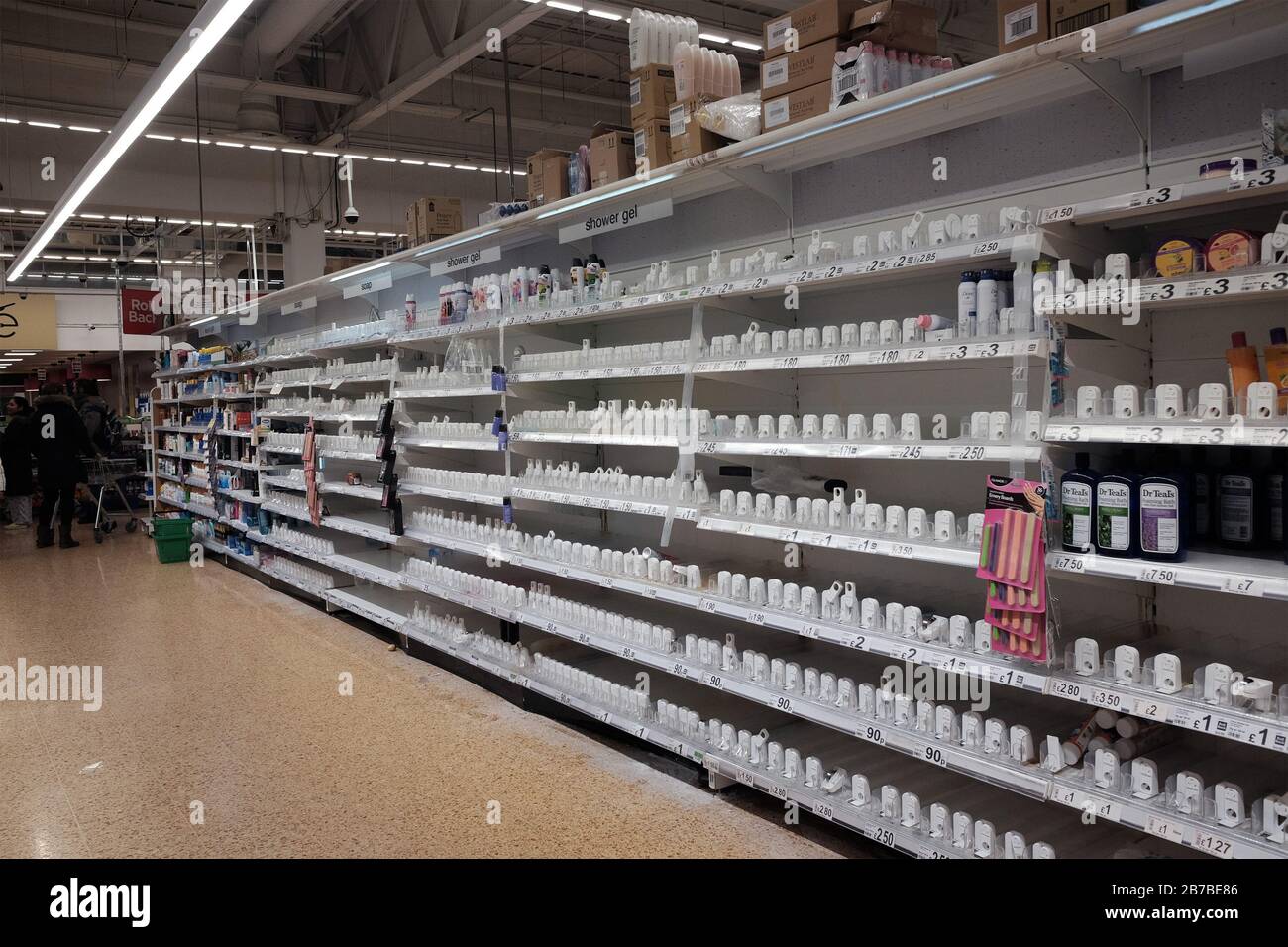 Empty shelves in the shower gel aisle of an Asda store in London Stock