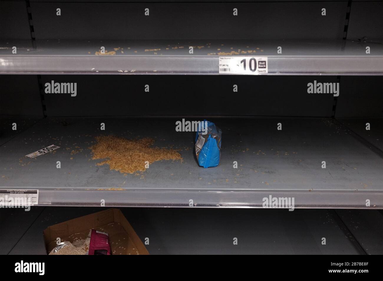 Empty shelves in the rice aisle of an Asda store in London Stock Photo