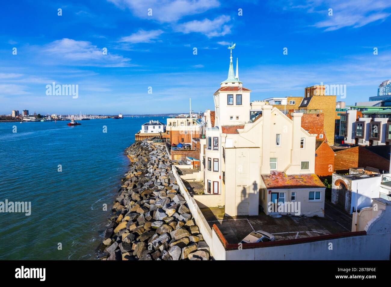 Coastline view of Tower House (former home of maritime artist William Wyllie), Old Portsmouth across Portsmouth Harbour towards Gosport, Hampshire, UK Stock Photo