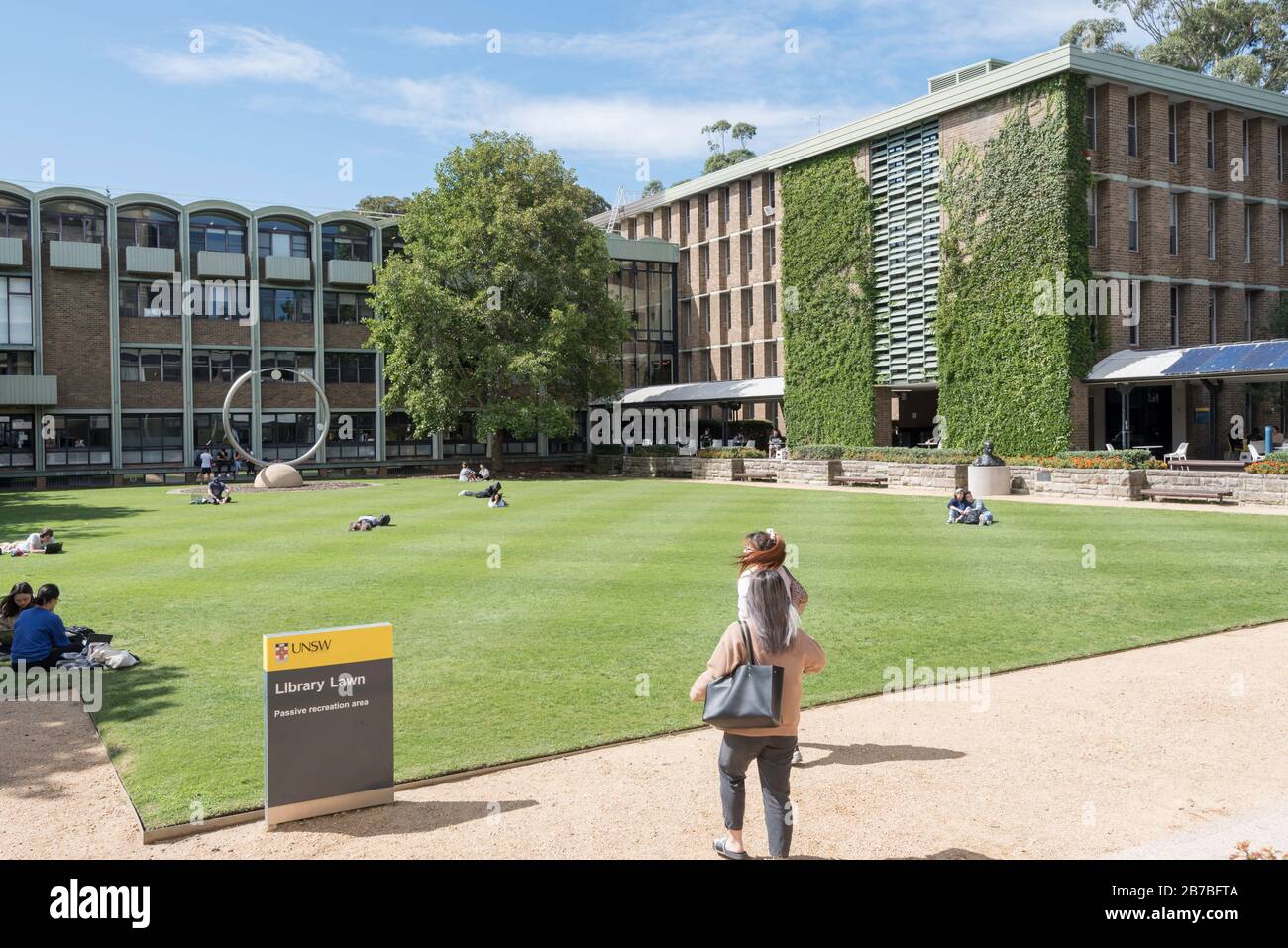 Students relaxing on the University of New South Wales, Library lawn