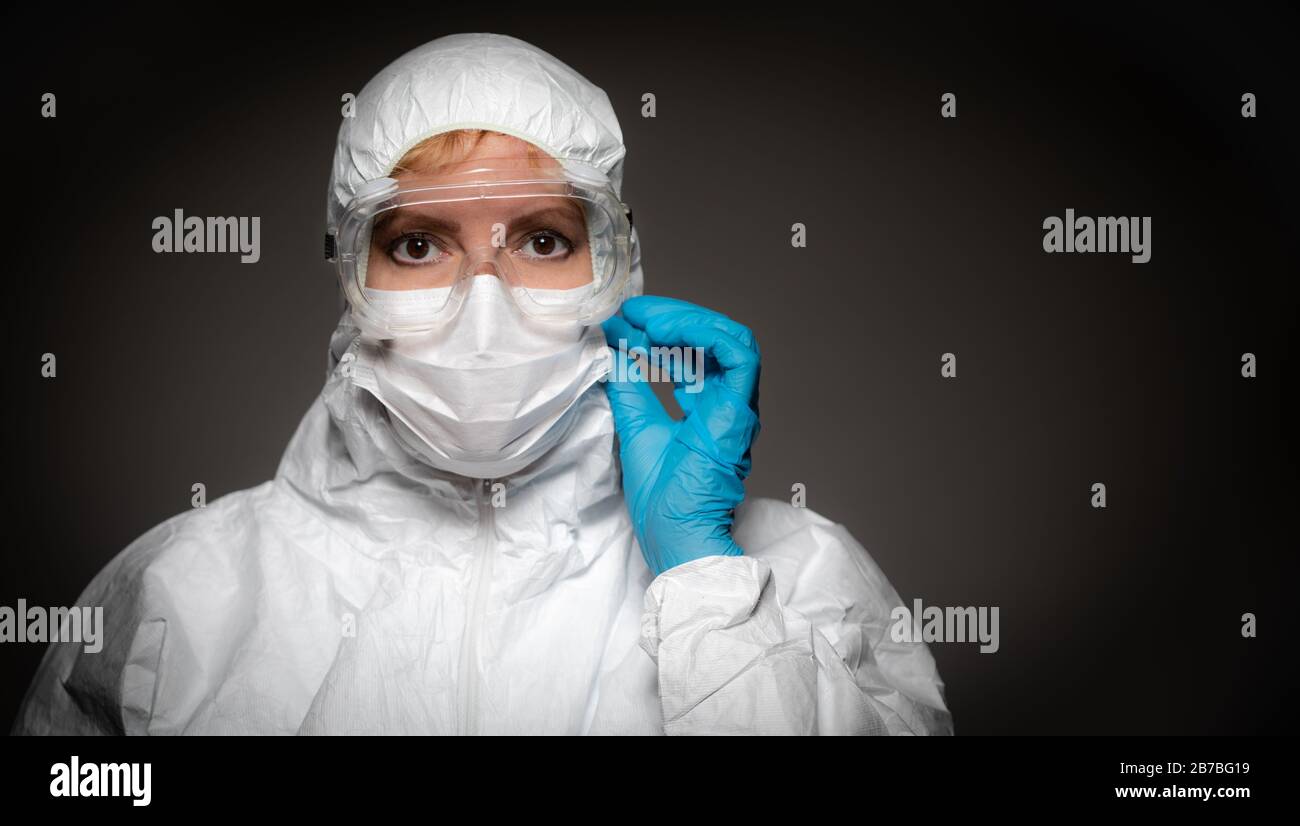 Female Medical Worker Wearing Protective Face Mask and Gear Against ...