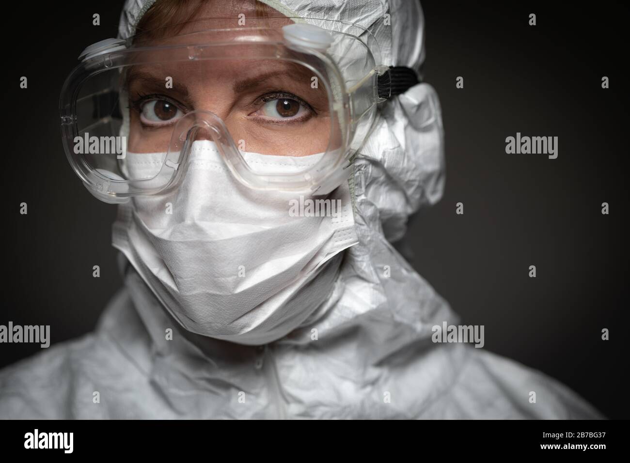 Female Medical Worker Wearing Protective Face Mask and Gear Against ...