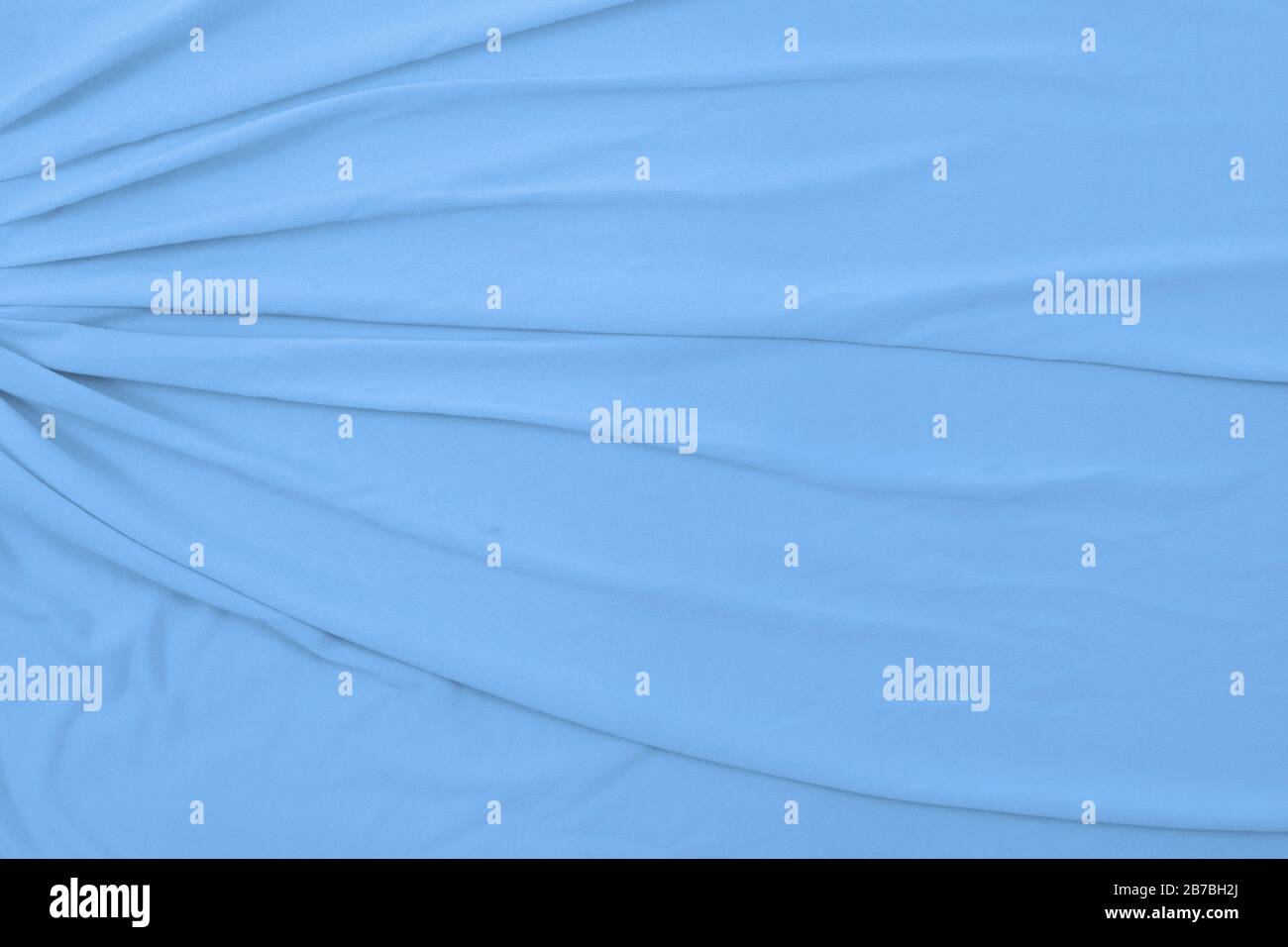 Top down view of flowing baby blue fabric. Stock Photo