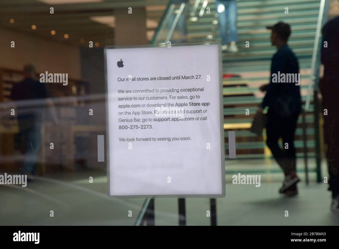 New York, USA. 14th Mar, 2020. The sign in the Manhattan Apple store in Soho is seen in this photo on Saturday, March 14, 2020 in New York. Apple CEO Tim Cook announced it will close all its retail stores outside Greater China until March 27th in order to o minimize the risk of transmission of COVID-19 virus. (Photo by Louis Lanzano/Sipa USA) Credit: Sipa USA/Alamy Live News Stock Photo