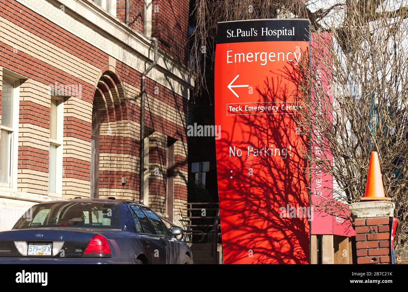 Vancouver, Canada - Feb 20, 2020: A view of St. Paul Hospital emergency sign in red with directional arrow points towards the emergency room entrance Stock Photo