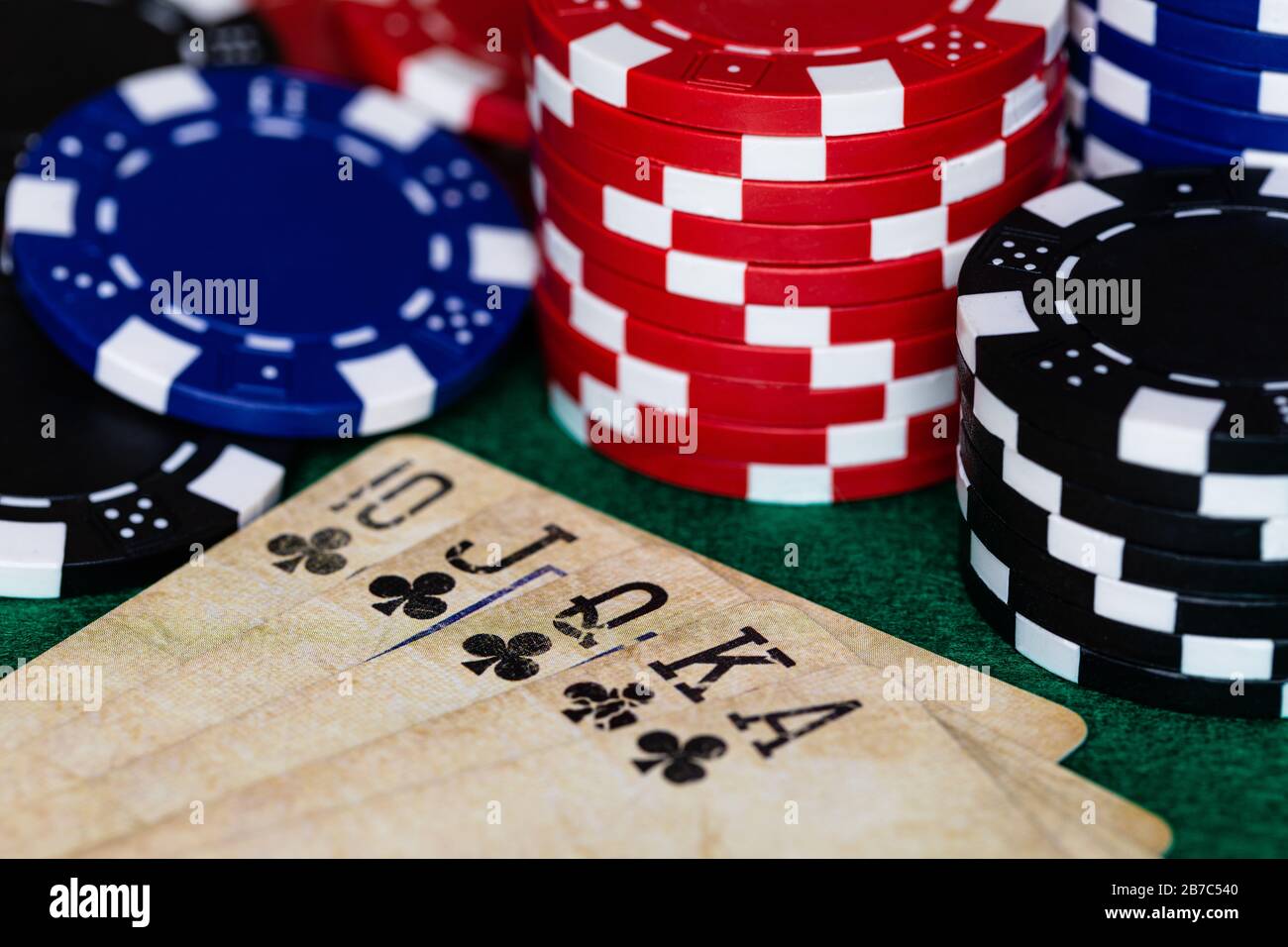 A Macro Image Of A Royal Club Flush On A Deck Of Vintage Used Cards 