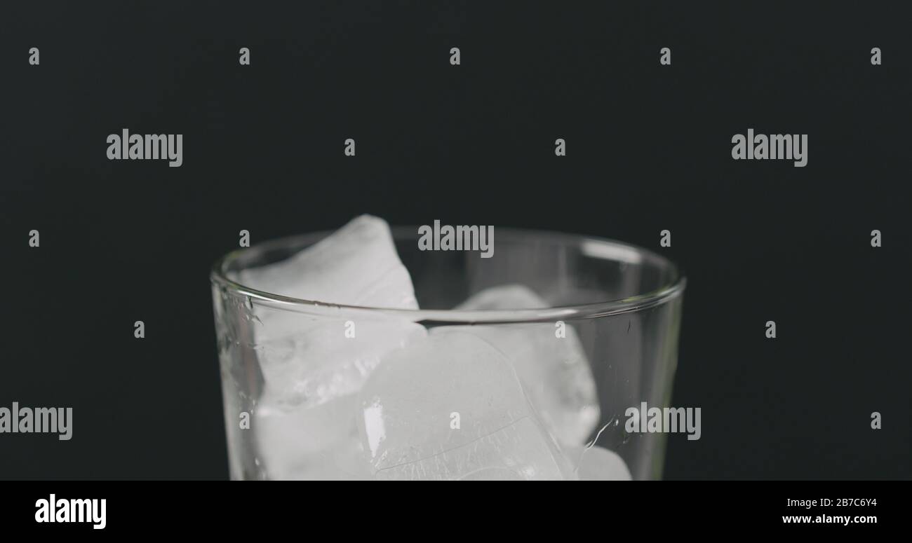 ice cubes in glass on black background closeup, wide photo Stock Photo ...
