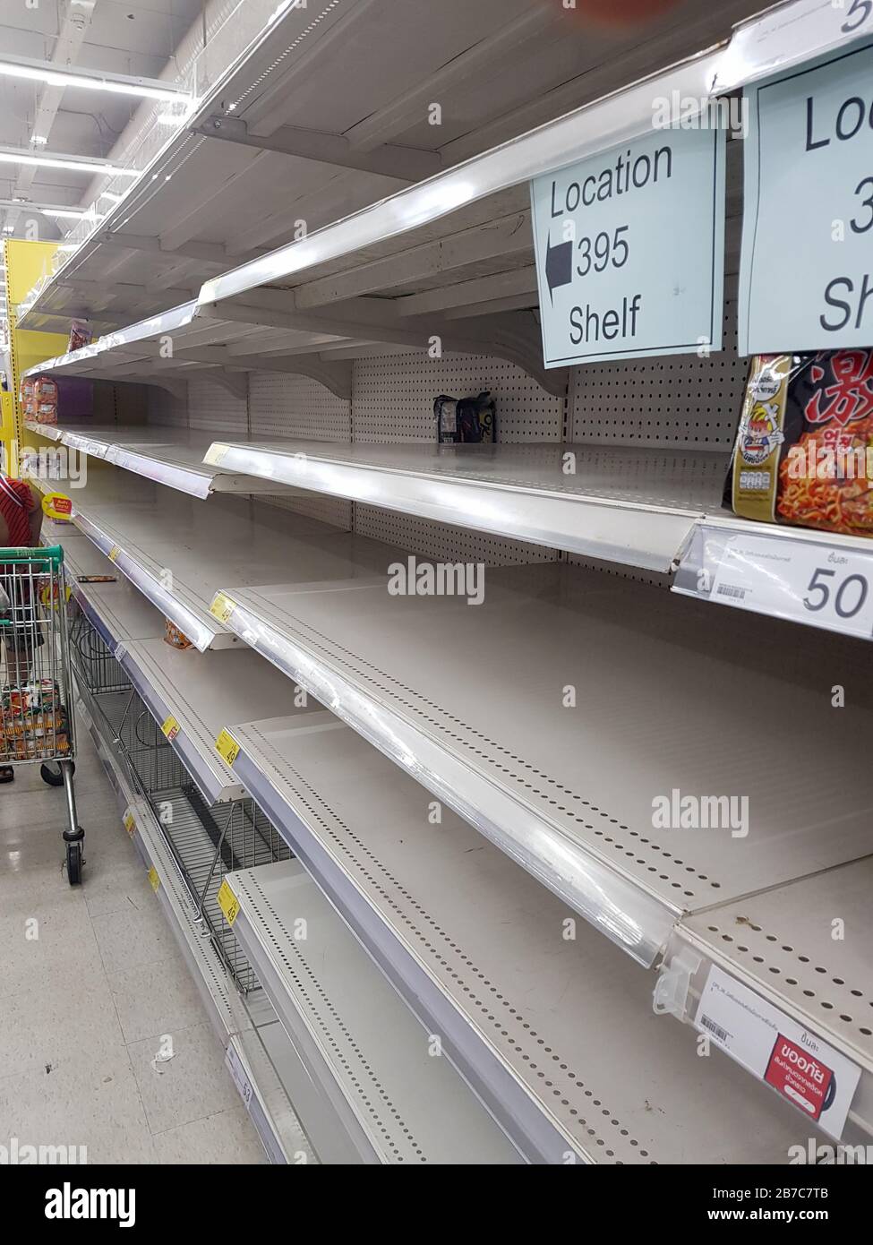 BANGKOK, THAILAND - MARCH 15, 2020 - Empty shelves in a supermarket because of hoarding shopping and panic of coronavirus covid 19 Stock Photo