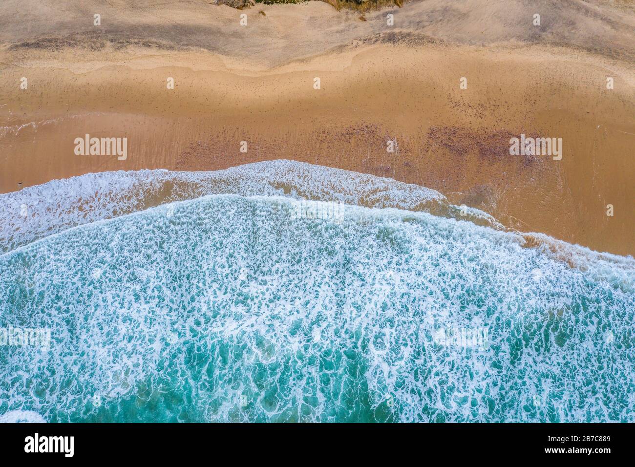 Algarve, Portugal. Waves, Rocks, Beach. Background. Aerial from above Stock Photo