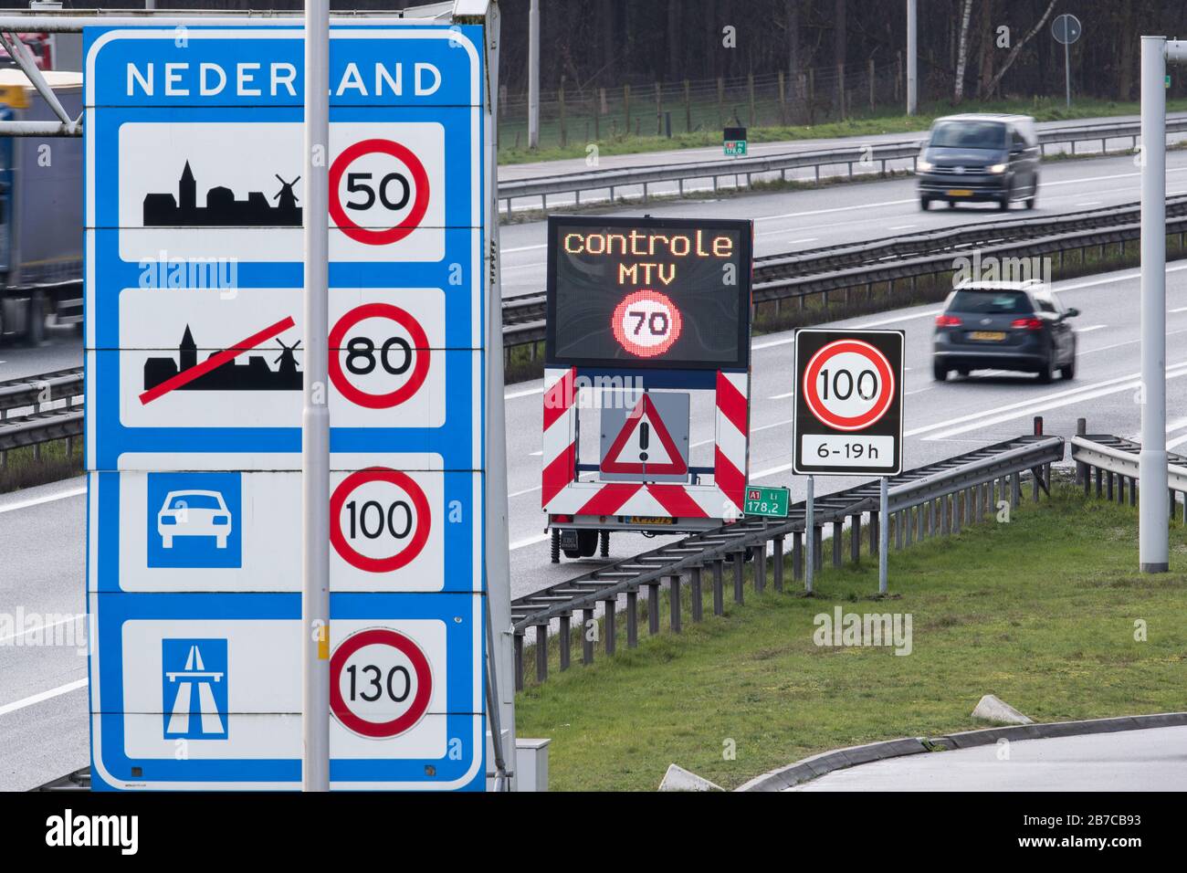 De Poppe, Netherlands. 13th Mar, 2020. Speed 100 from 6 to 19 o'clock is written on a traffic sign on a motorway on the border between the Netherlands and Germany. After Norway and Cyprus, the Netherlands is also introducing a 100 km/h speed limit on all its motorways. Credit: Friso Gentsch/dpa/Alamy Live News Stock Photo