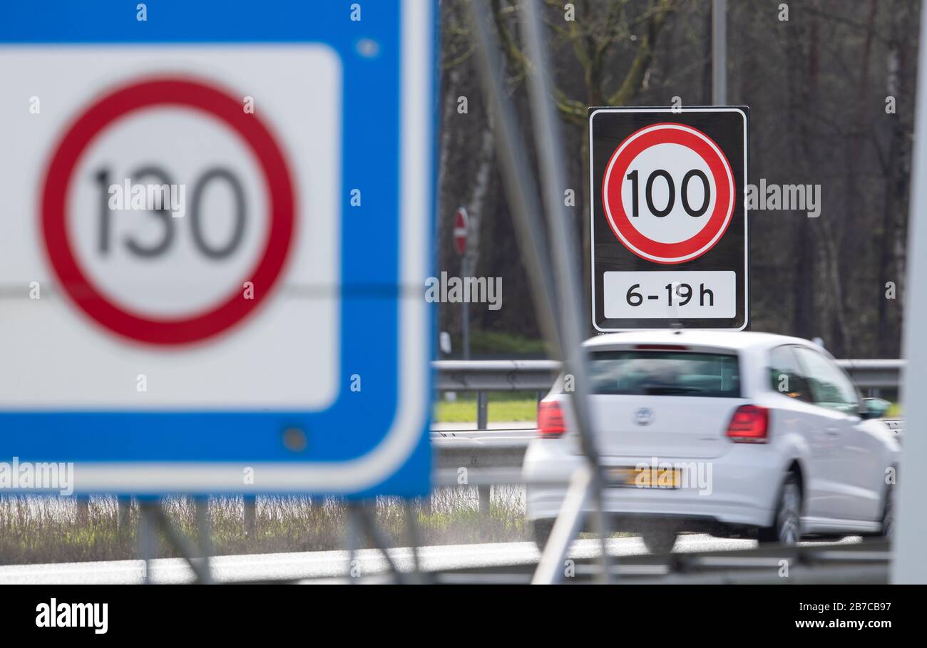 De Poppe, Netherlands. 13th Mar, 2020. Speed 100 from 6 to 19 o'clock is written on a traffic sign on a motorway on the border between the Netherlands and Germany. After Norway and Cyprus, the Netherlands is also introducing a 100 km/h speed limit on all its motorways. Credit: Friso Gentsch/dpa/Alamy Live News Stock Photo