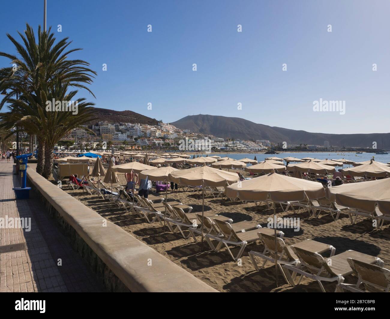 Beachfront promenade at Playa de las Vistas in Los Cristianos, Tenerife, Canary islands Spain, on a warm sunny day Stock Photo