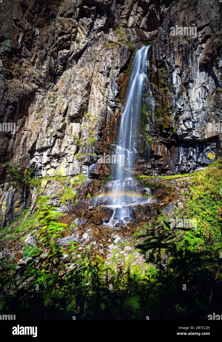 Beautiful waterfall with rainbow in the mountain valley, Kazakhstan, Central Asia Stock Photo