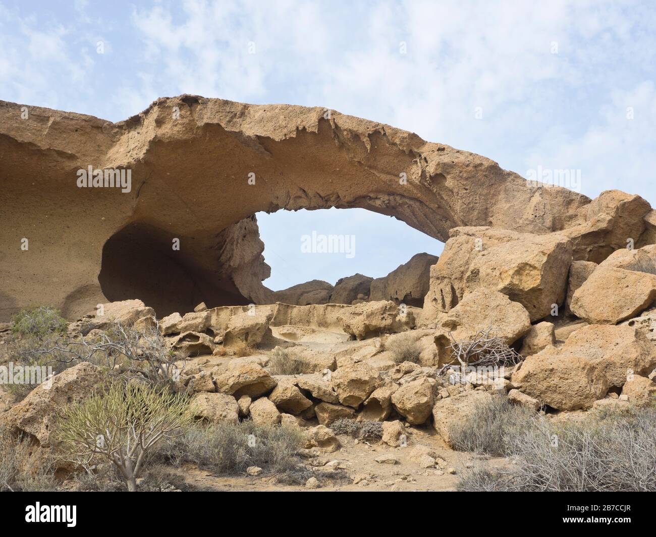 Volcanic rock and erosion created this natural arch and other bizarre rock formations in Tajao, Tenerife, Canary islands Spain Stock Photo