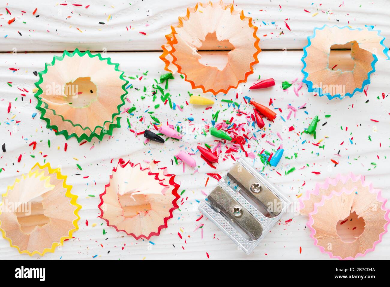 Pencil sharpener on a white wooden background Stock Photo