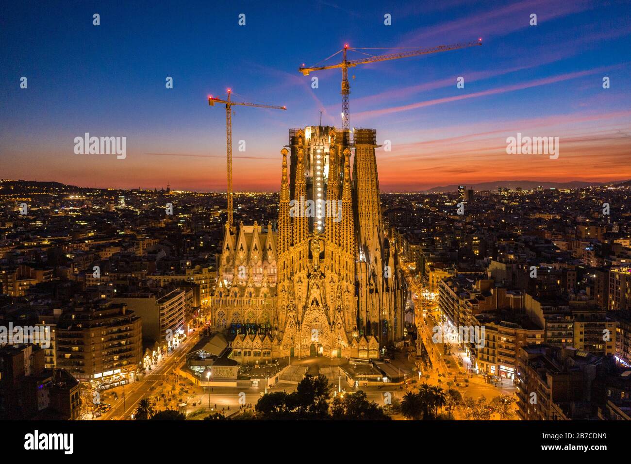 Nativity Facade of the Sagrada Família and Eixample in Barcelona during the evening twilight. (Catalonia, Spain) Stock Photo