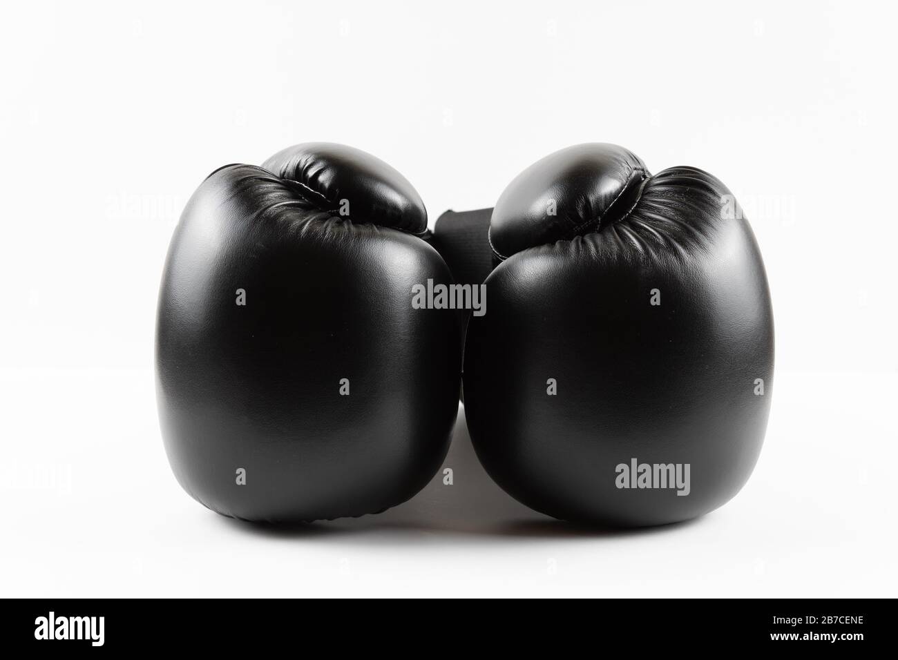 Pair of black boxing gloves on a white background. Copy space Stock Photo