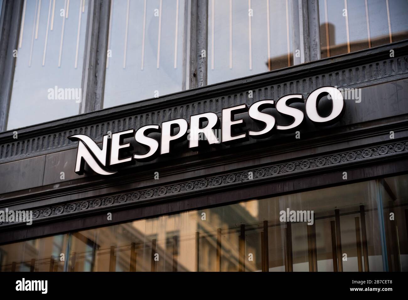 A Swiss coffee capsules brand and a unit of the Nestle Group, Nespresso logo seen at one of their stores. Stock Photo