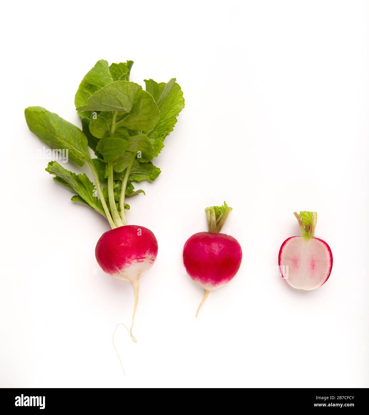 Radish with and without leaves, and root cut in half Stock Photo Alamy