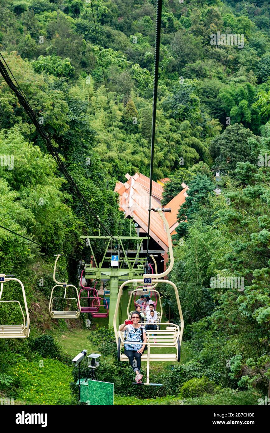 Tourists Riding The Cable Car To The Top At Jiuxiang Gorge And Cave ...