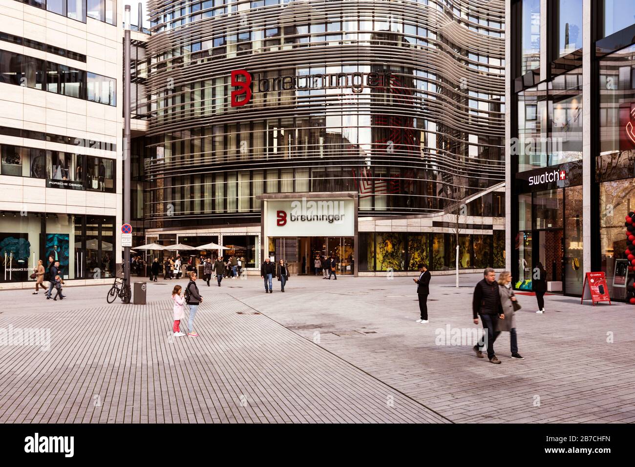 Pedestrian zone Schadowplatz with luxery department stores on Ko-Bogen in the city center of Dusseldorf next to the boulevard Konigsallee Stock Photo