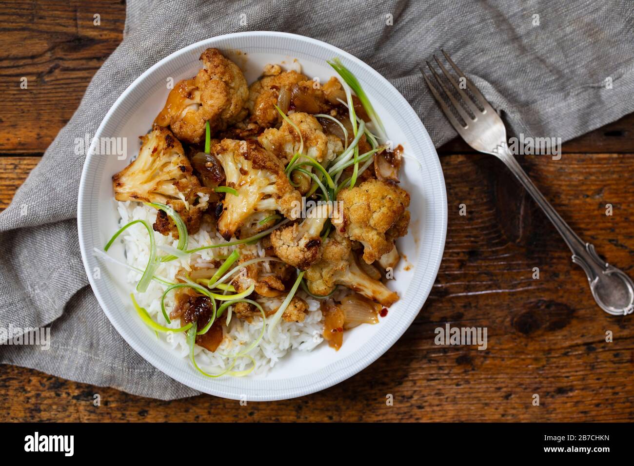 Roast cauliflower with adobo sauce and rice Stock Photo