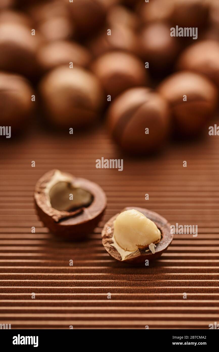 fresh macadam nut close-up on a brown background Stock Photo