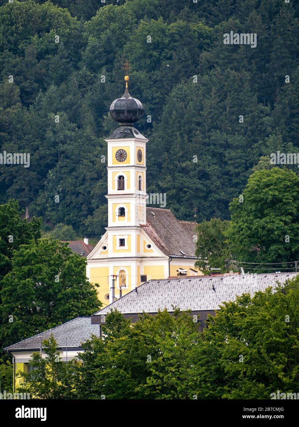 WERNSTEIN AM INN, GERMANY - JULY12, 2019:  Pfarrkirche Church seen from the river Inn Stock Photo