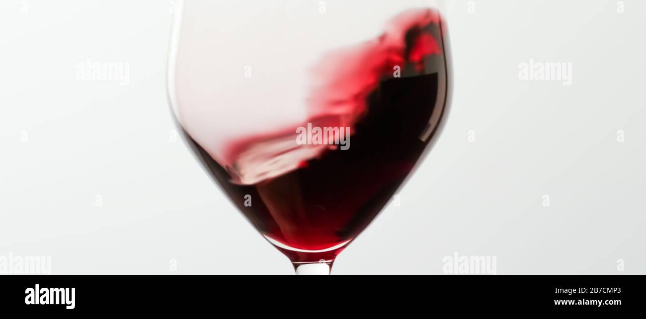 Glass of red wine at tasting event, quality control and alcoholic