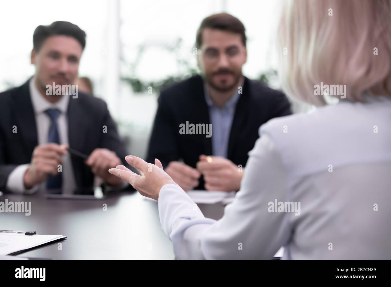 Female job candidate have interview with male employers Stock Photo