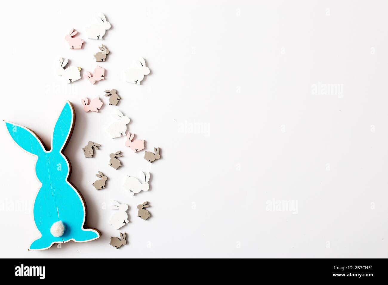 Blue wooden flat easter bunny is on a white background. Copy space Stock Photo