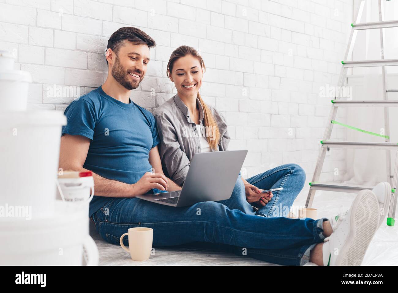 Young couple planning design project for apartment Stock Photo