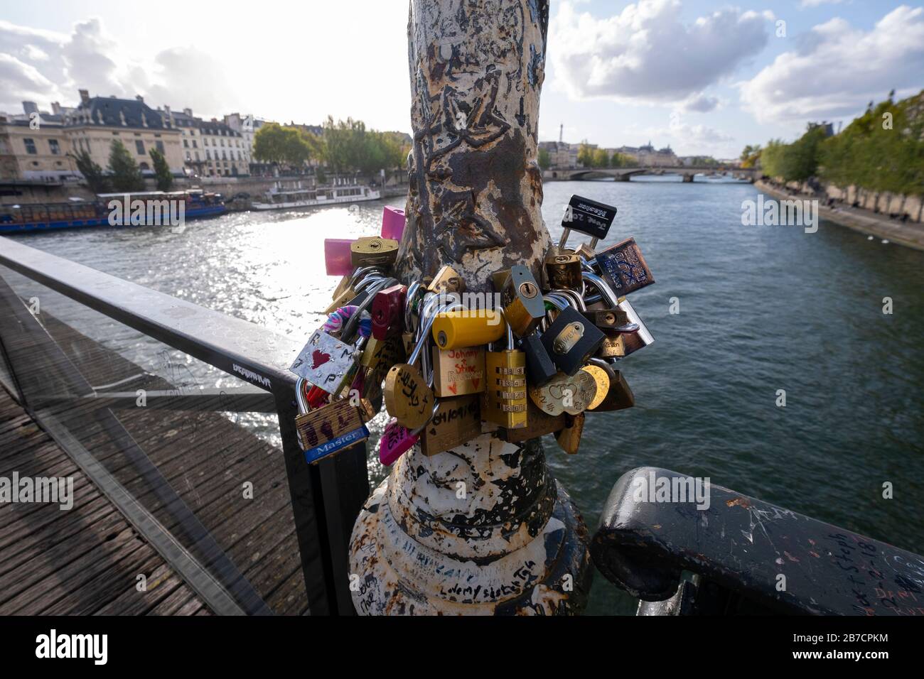 Padlocks around a lamp post on the Pont des Arts in Paris, France, Europe Stock Photo