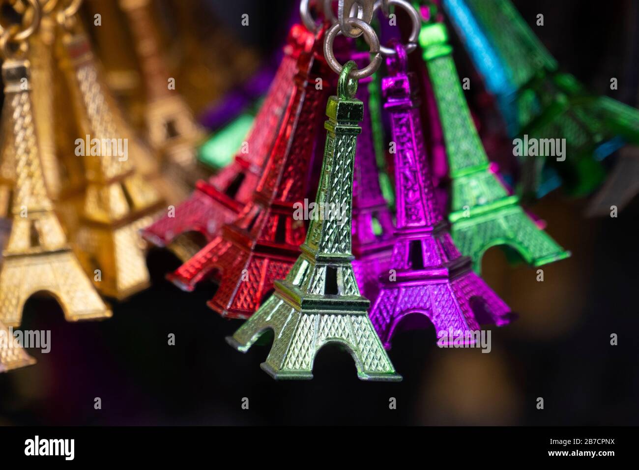 Colorful miniature Eiffel Tower metallic key-chains Paris souvenirs for sale Stock Photo