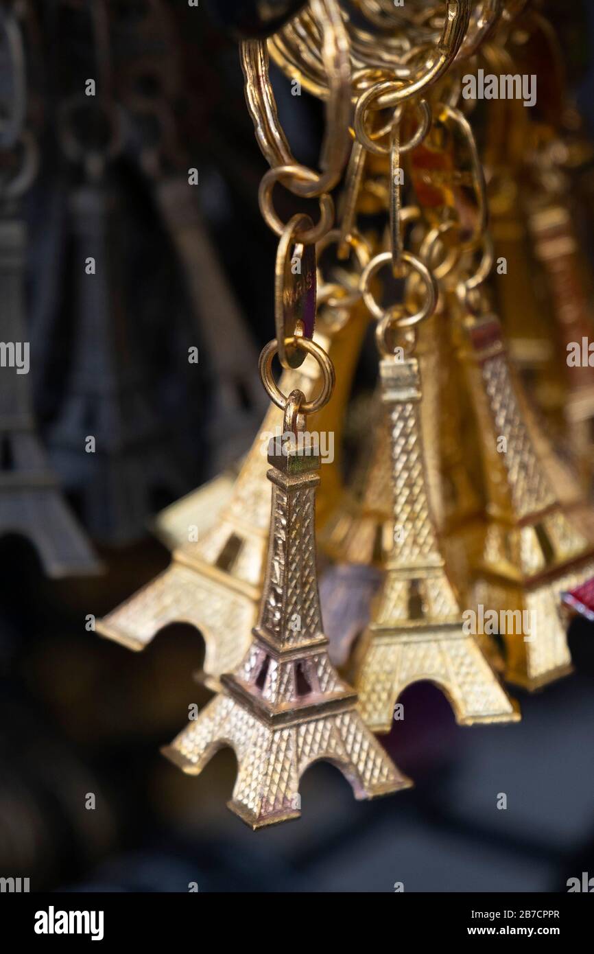 Miniature Eiffel Tower metallic key-chains Paris souvenirs for sale Stock Photo