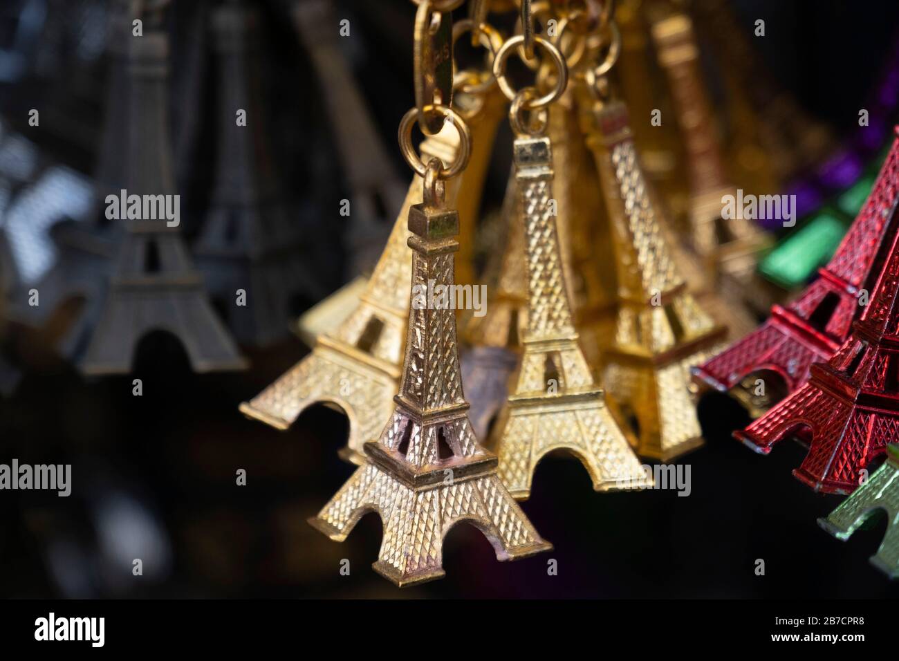 Colorful miniature Eiffel Tower metallic key-chains Paris souvenirs for sale Stock Photo