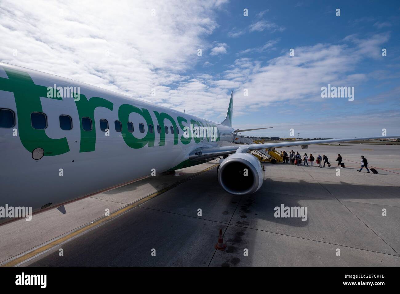 Passengers boarding a Transavia airplane on an airport runway Stock Photo