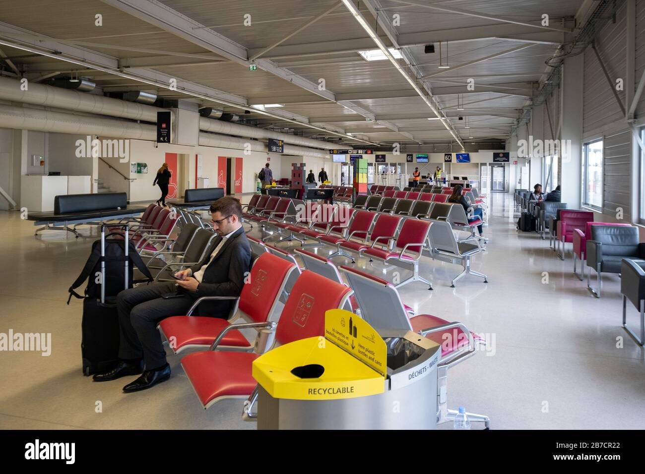 Businessman waiting for his flight at the Paris Orly airport in Paris, France, Europe Stock Photo