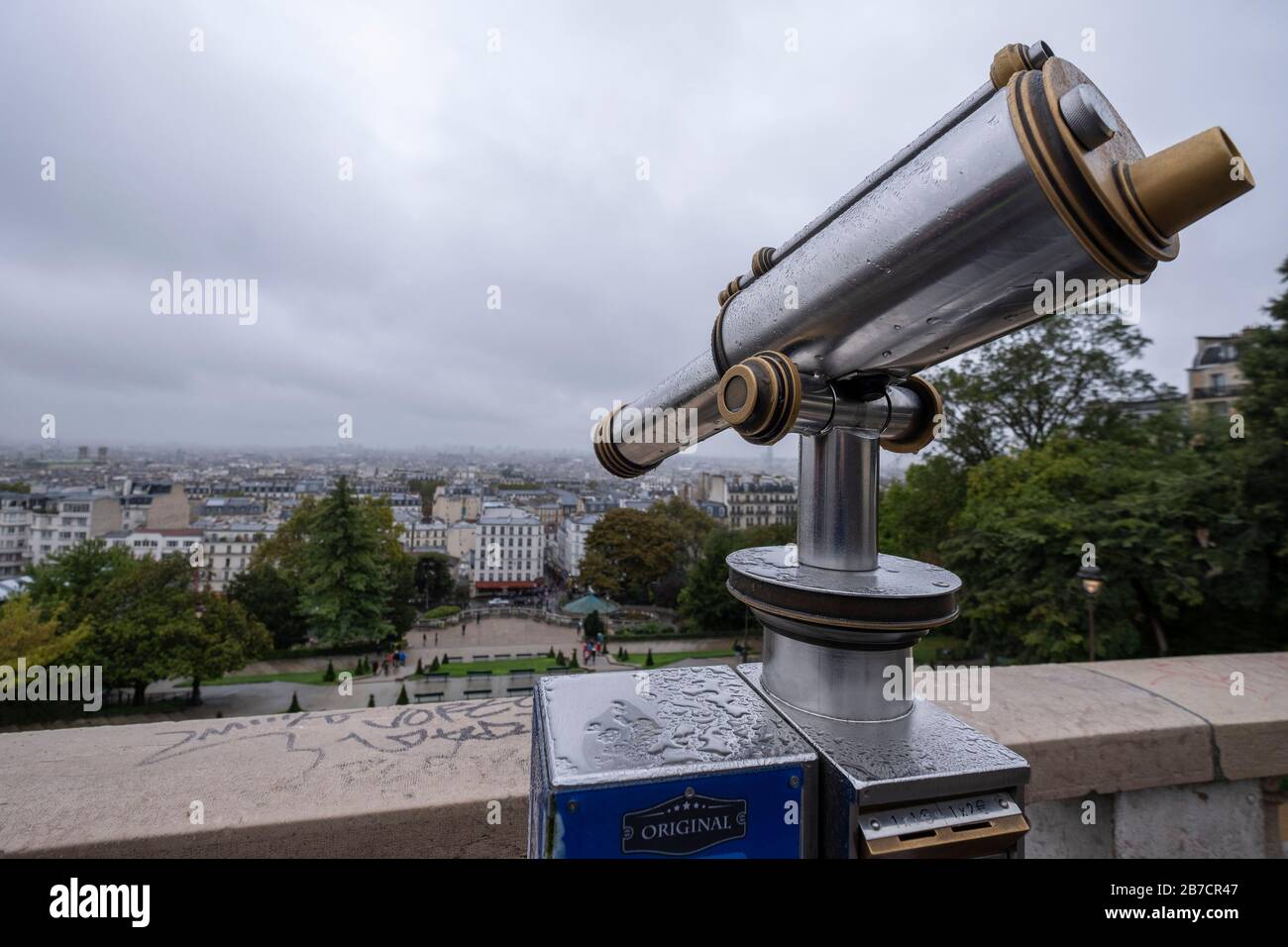 Coin operated sightseeing telescope overlooking the Paris skyline from Montmartre in Paris, France, Europe Stock Photo