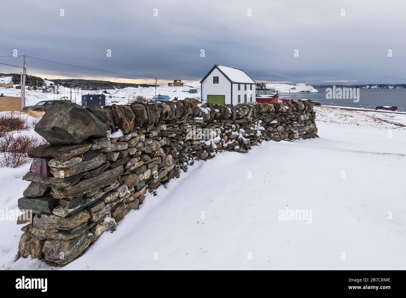 All Saints Anglican Church behind a dry stone wall art installation in