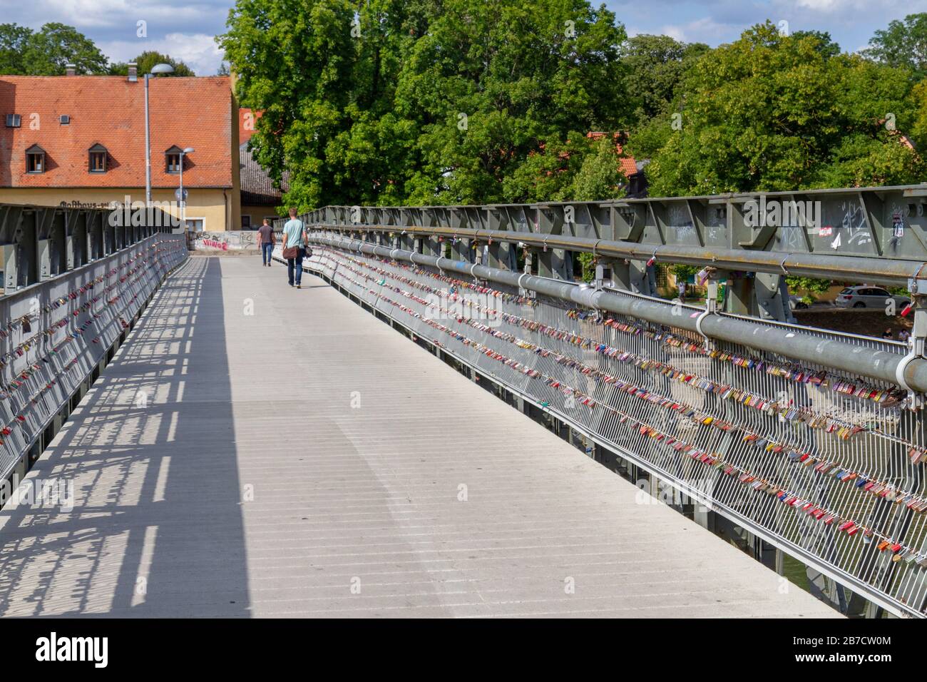 The Eiserner Steg Regensburg pedestrian bridge over the River Danube in Regensburg, Bavaria, Germany. Stock Photo