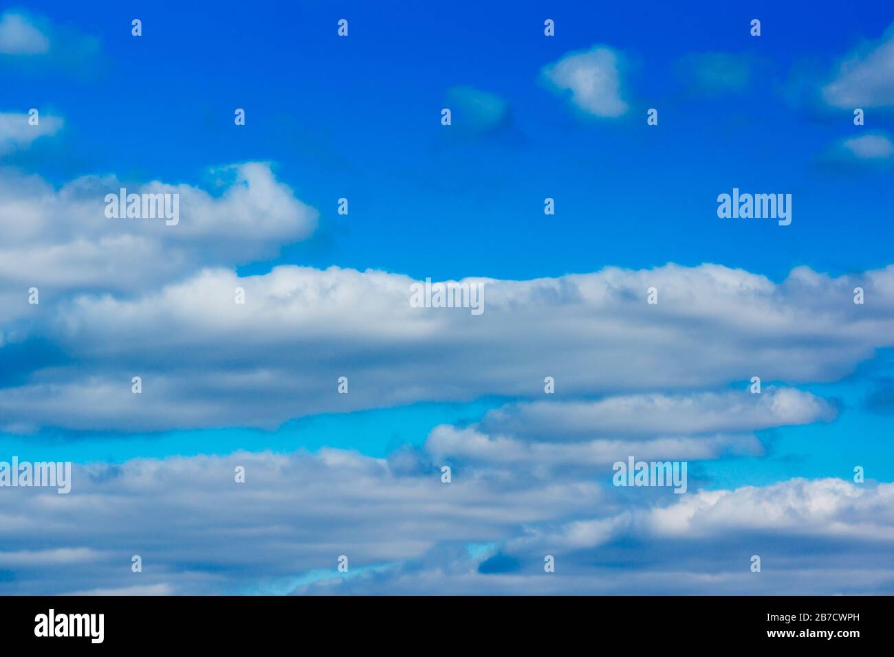 blue sky with flying white light clouds Stock Photo - Alamy