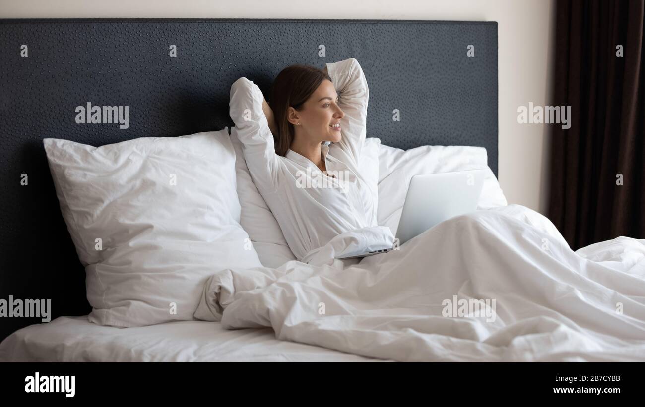 Woman computer happy bed hi-res stock photography and images - Alamy